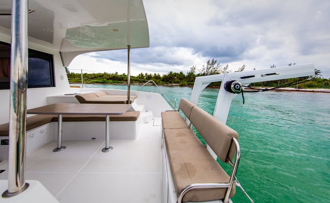 Catamaran anchored in a turquoise Caribbean cove
