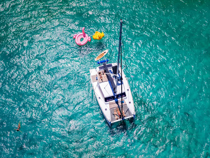 Catamaran sailing on turquoise Caribbean water