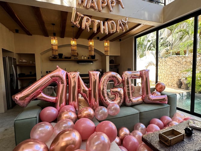 Villa bedroom decorated with balloons and flowers for celebration