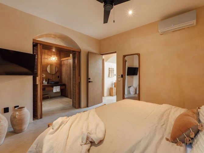 Massage therapist performing in-villa treatment